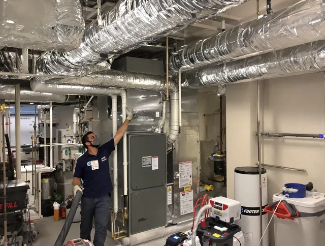 Hull Air Duct Cleaning specialist performing thorough furnace duct cleaning in a Hull residence